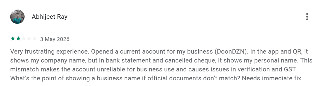 Abhijeet Ray's Google Play review highlighting the business name mismatch issue on Slice current account — bank statement and cancelled cheque show personal name instead of firm name
